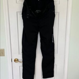 Black women’s Spidi brand waterproof motorcycle pants.